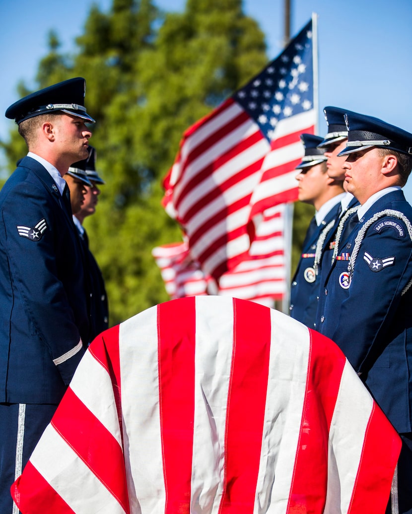 A military honor guard stands guard over the remains of retired Army Air Corps 1st...