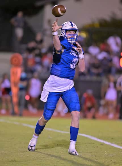 Trinity Valley quarterback Gavin Parkhurst attempts a pass in a high school football game...