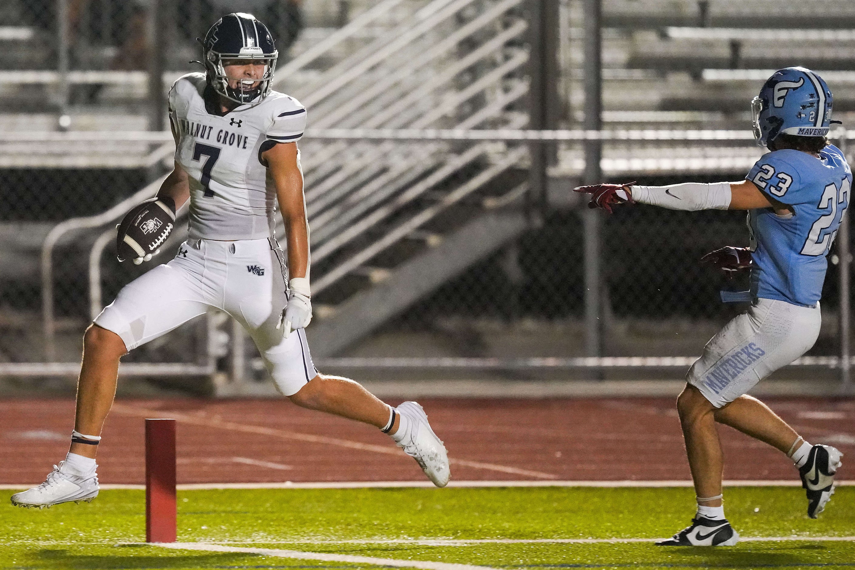 Prosper Walnut Grove wide receiver John Hutson (7) scores on a 22-yard touchdown reception...