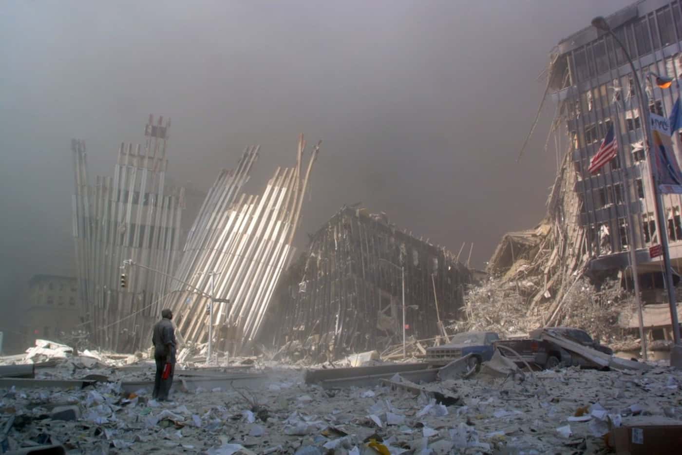 In this file photo taken on Sept. 11, 2001, a man stands in the rubble, calling out to ask...