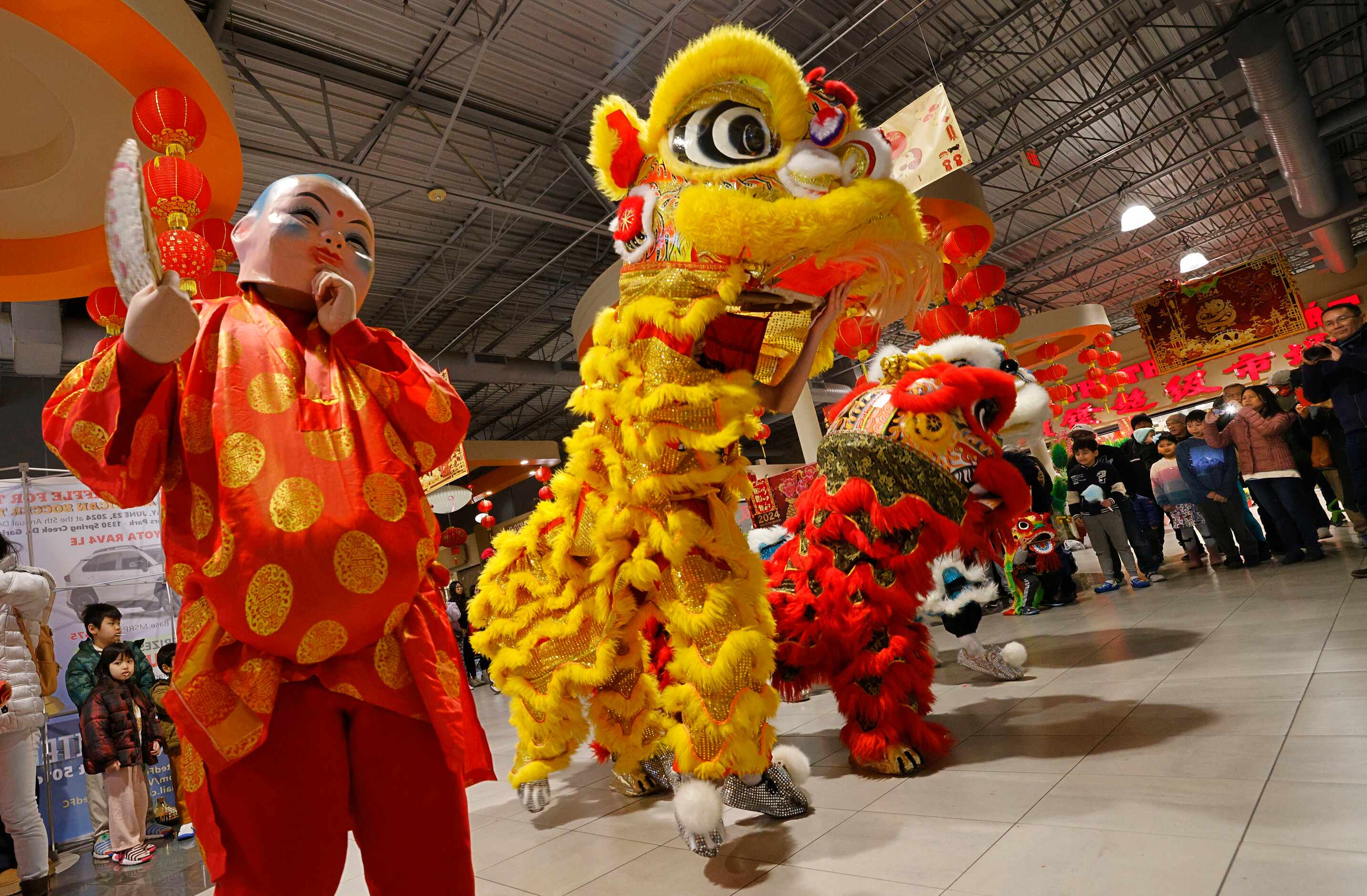 Dancers from Ngoc Nhien Buddhist Youth Association perform lion dance during a Lunar New...