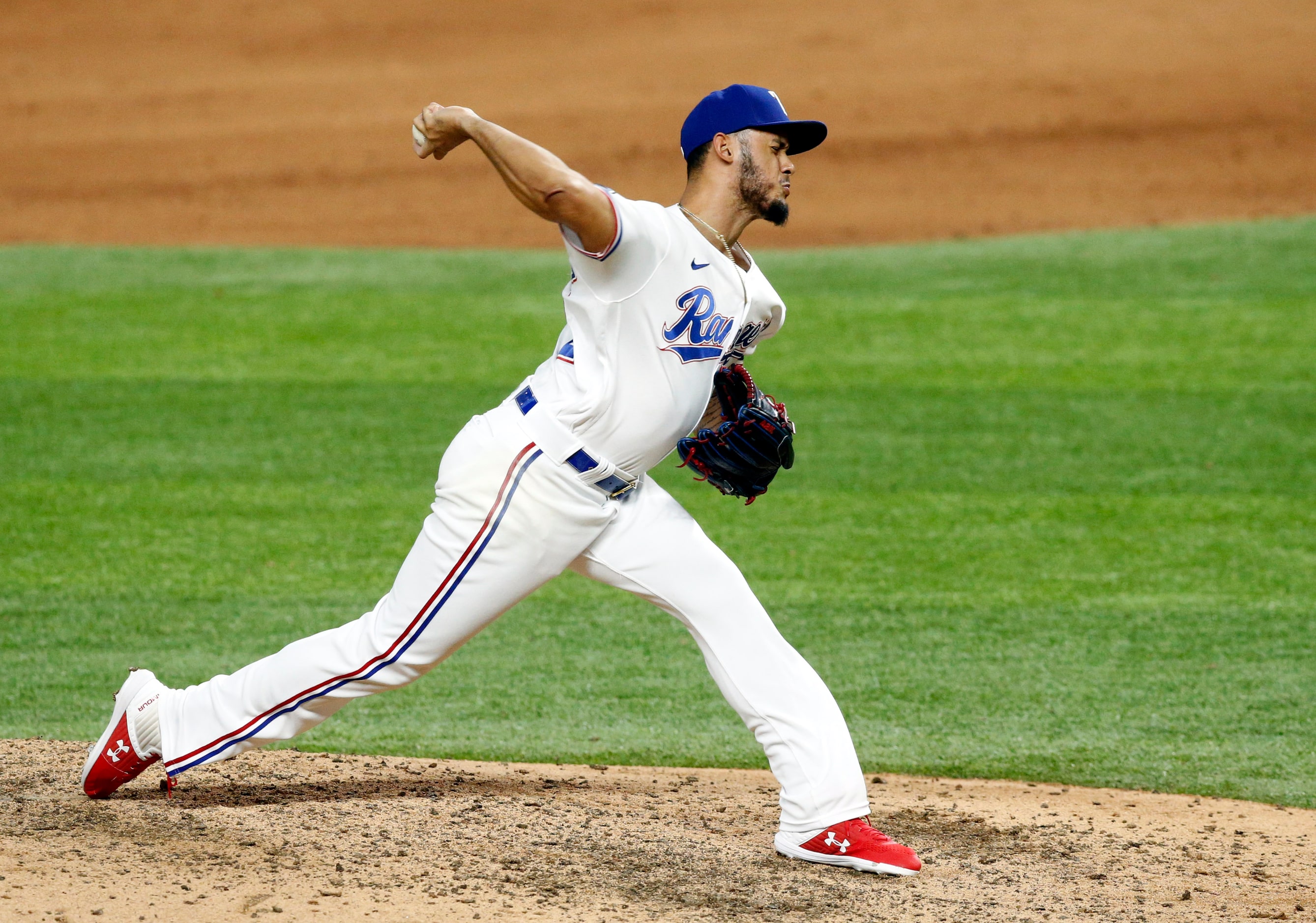 Texas Rangers relief pitcher Jonathan Hernandez (72) throws during the eighth inning against...