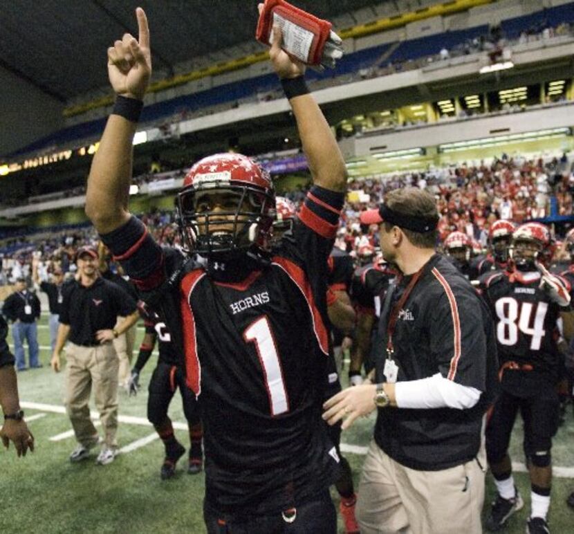 Cedar Hill QB William Cole (1) celebrates the Longhorns 51-17 victory over Cypress Falls for...