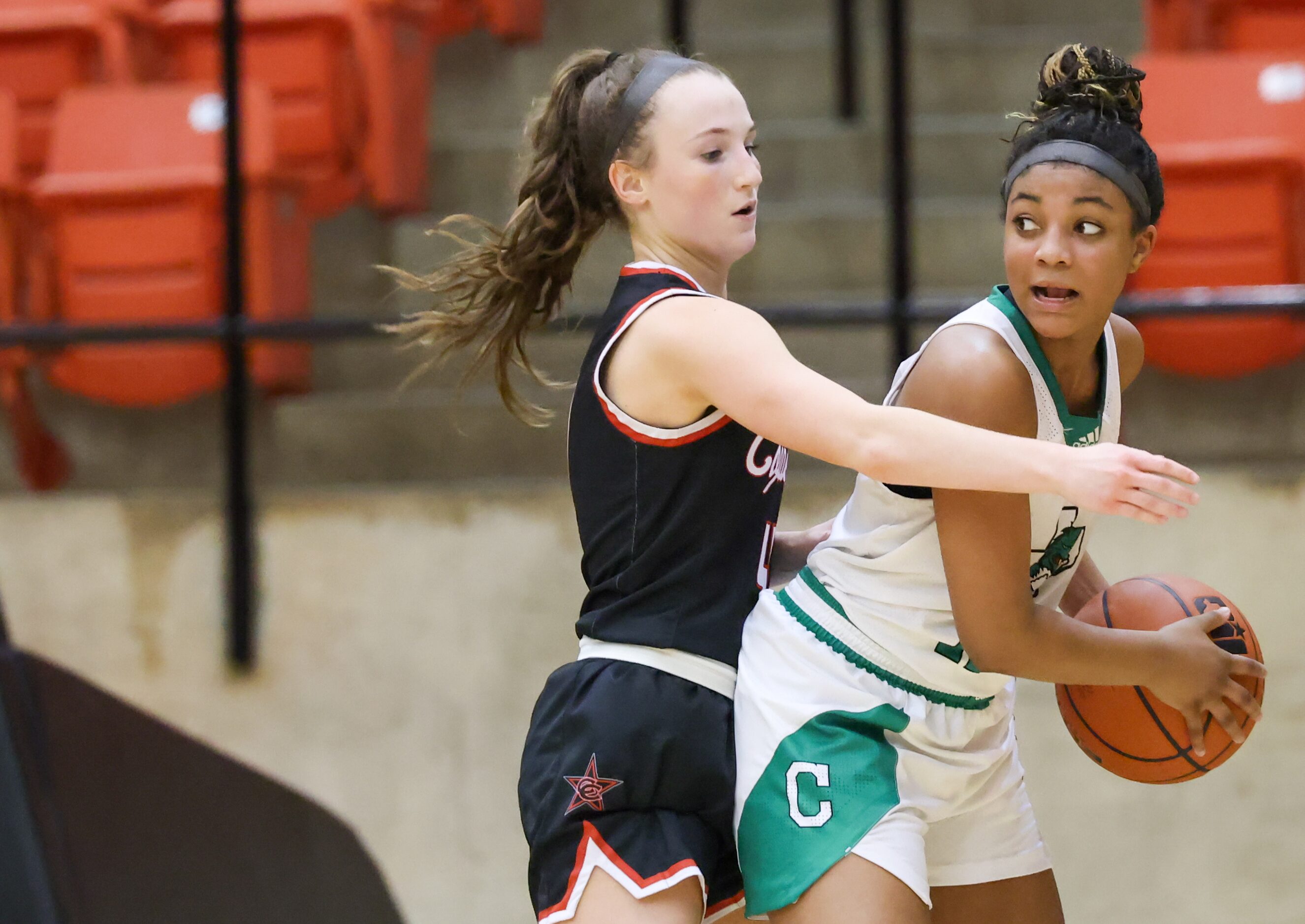 Coppell senior guard Allyssa Potter (4) reaches across Southlake Carroll freshman guard...