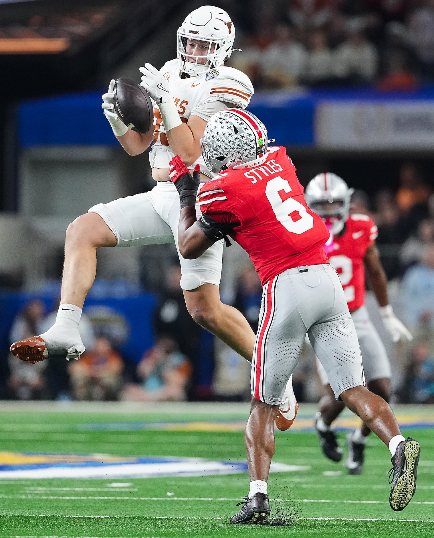 Ohio State safety Sonny Styles (6) breaks up a pass intended for Texas tight end Gunnar Helm...