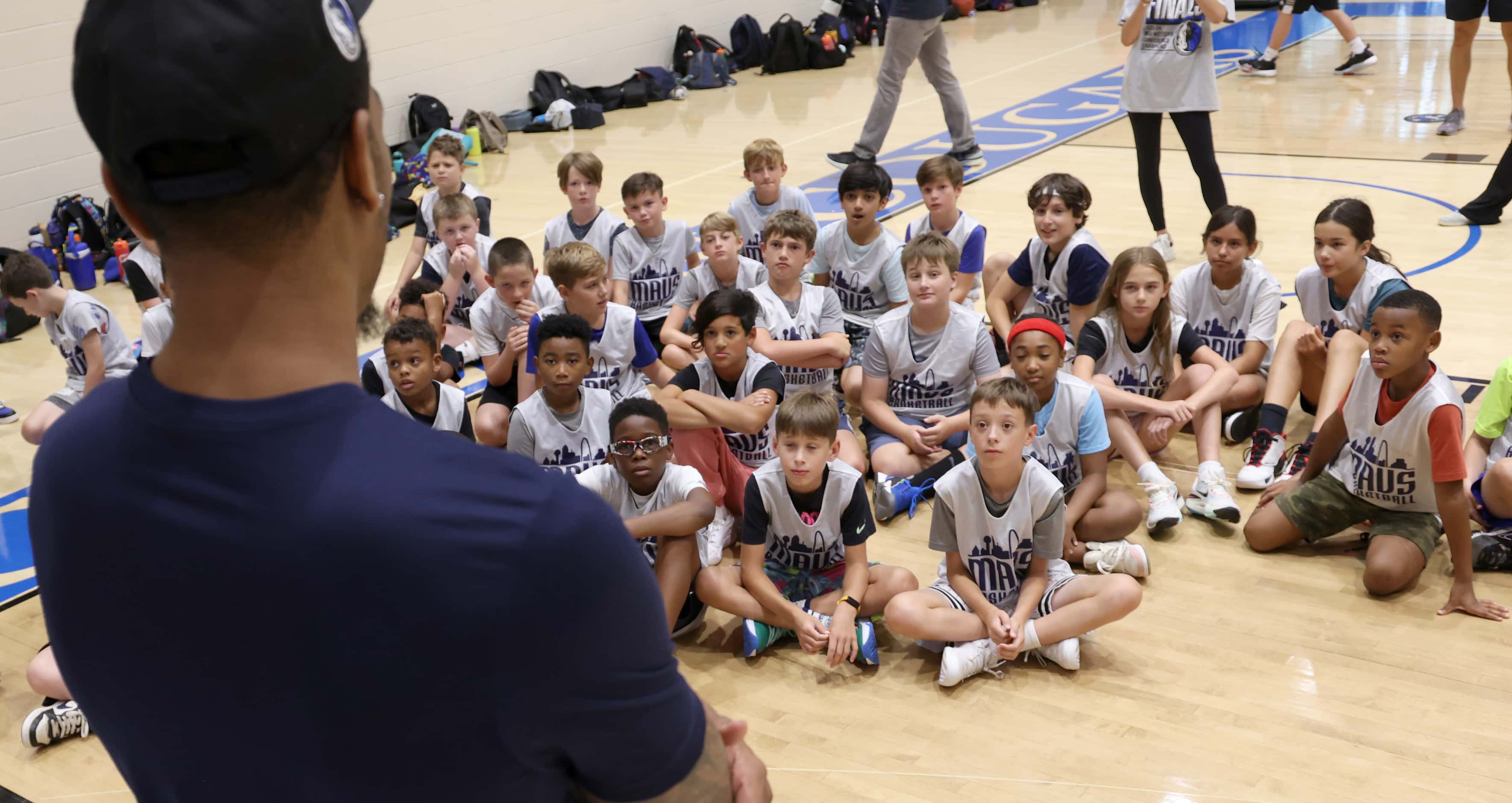 Dallas Mavericks forward and center PJ Washington answers a question during Hoop Camp which...