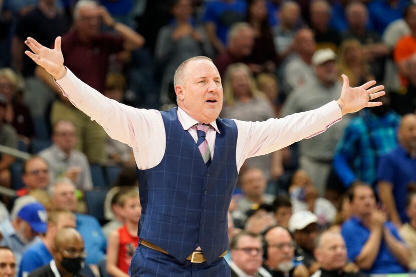 Texas A&M head coach Buzz Williams waves at his players during overtime of an NCAA men's...