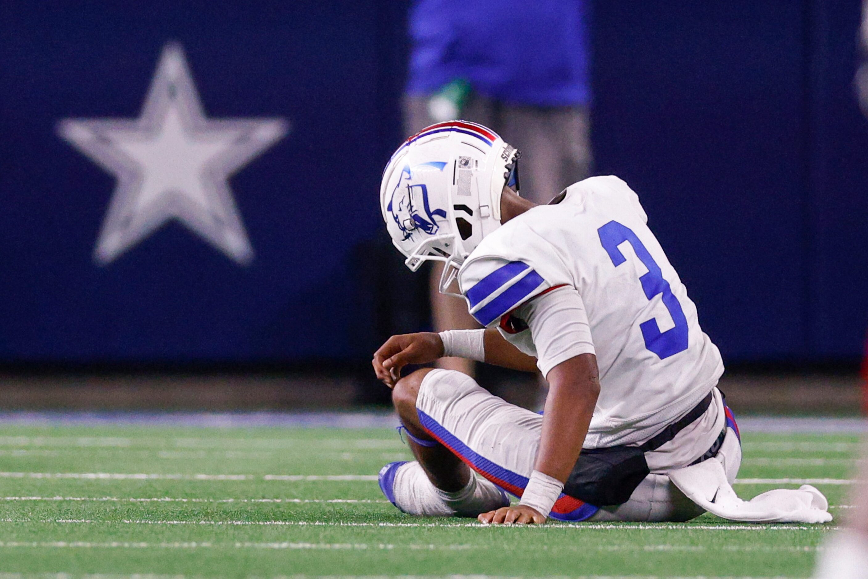 Duncanville quarterback Solomon James (3) sits on the field after throwing an interception...