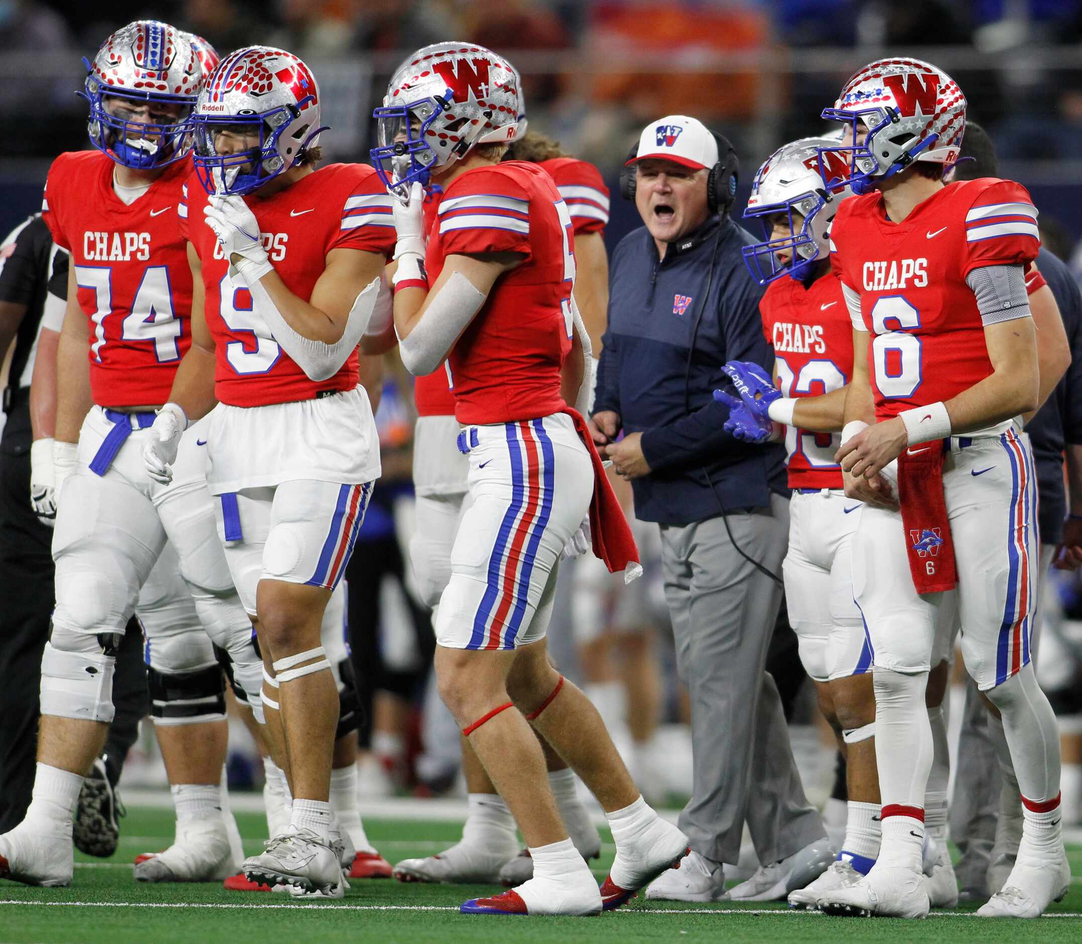 Austin Westlake head coach Todd Dodge conveys wisdom to his players breaking huddle from a...