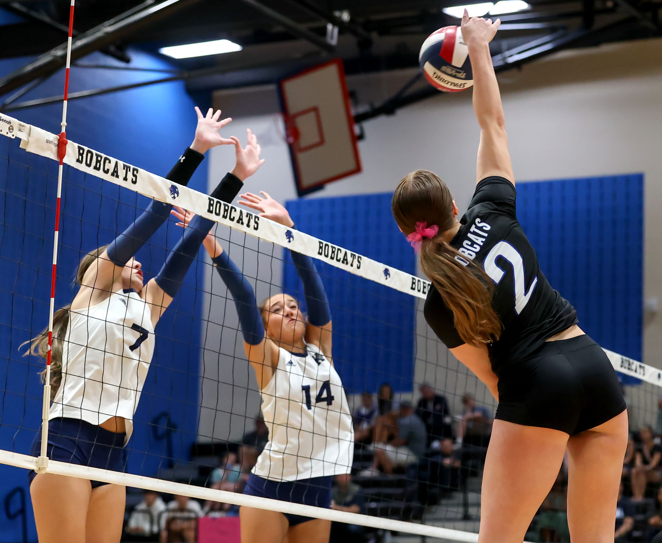 Byron Nelson's Kylie Klecknet (2) tries to get a kill past Keller's Carley Wright (7) and...