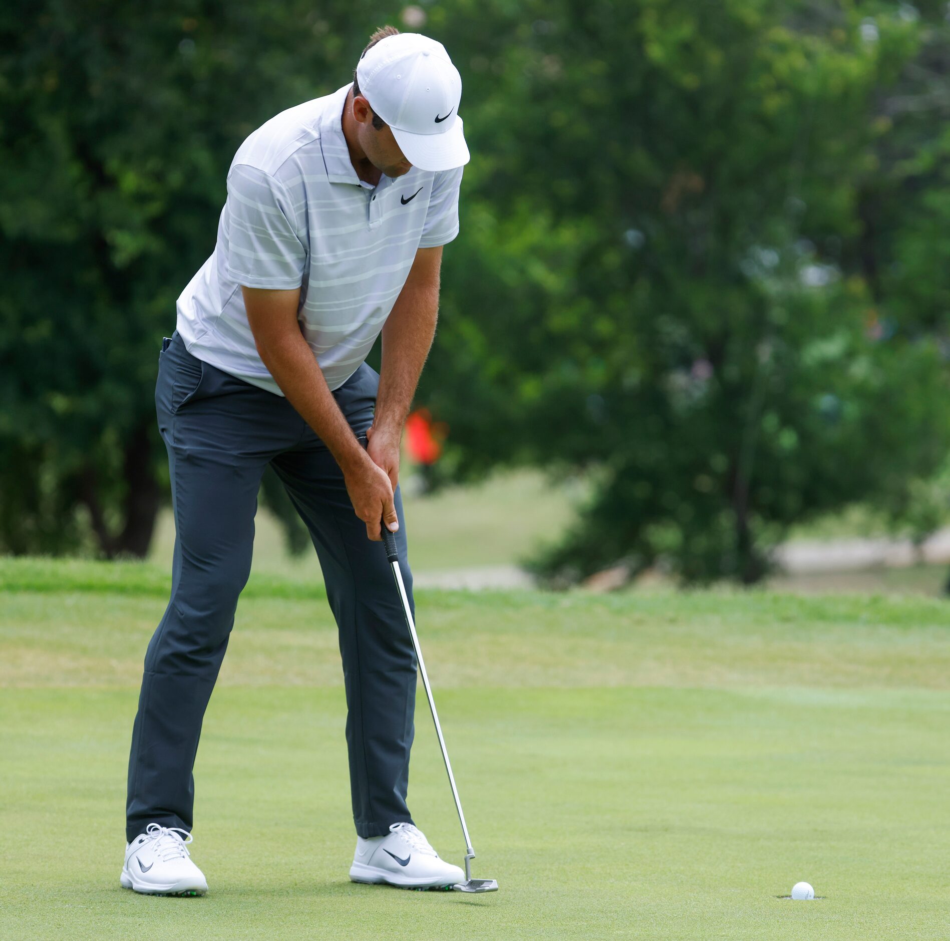 Scottie Scheffler putts on the eighth hole during the second round of the AT&T Byron Nelson...