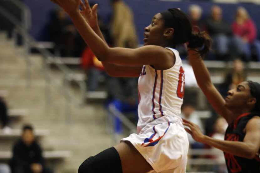 Duncanville Pantherettes guard Zarielle Green (00) lays up a shot against South Grand...