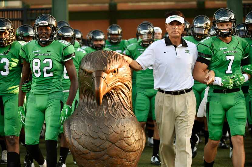 North Texas interim head coach Mike Canales touches Spiriki as the Mean Green take the field...