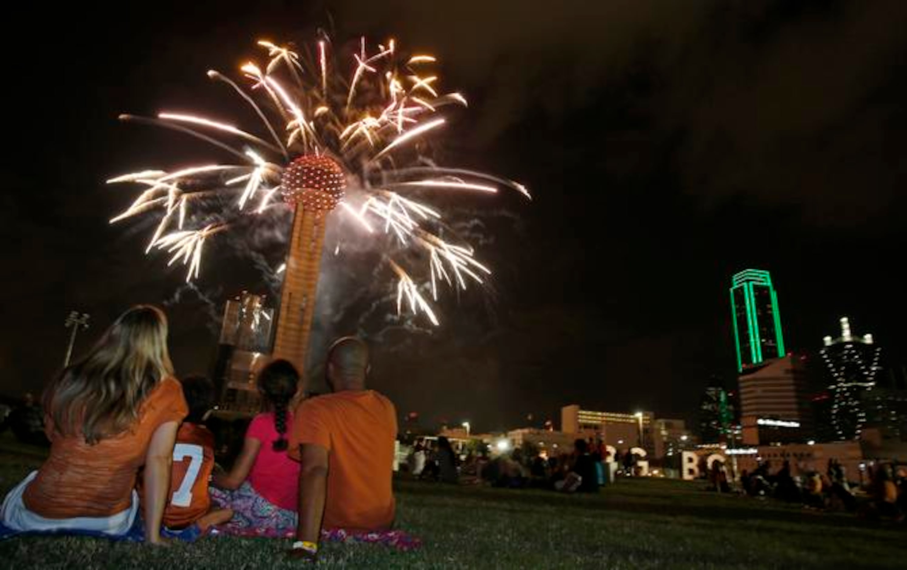 
Amanda, Brodie, Caitlyn and Eric Clemons of Austin sit mesmerized as Reunion Tower puts on...