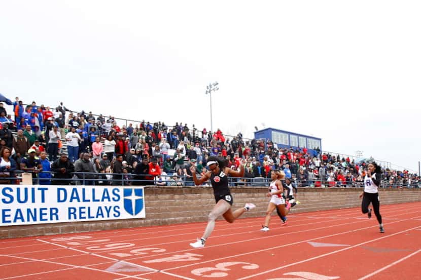 Kaylor Harris of Mesquite Horn stretches across the finish line in the 100 meter dash at the...
