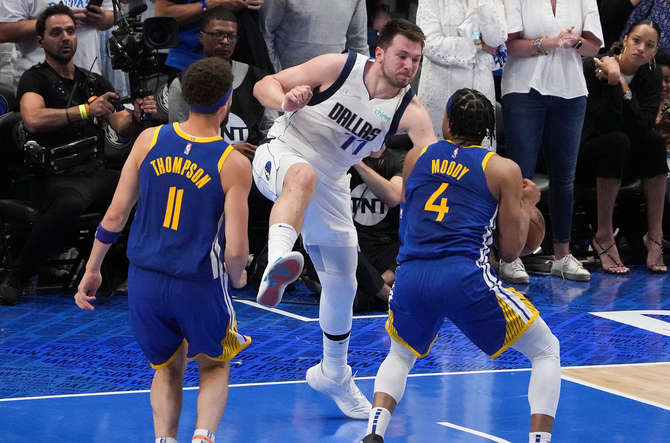 Dallas Mavericks guard Luka Doncic (77) knocks the ball away from Golden State Warriors...