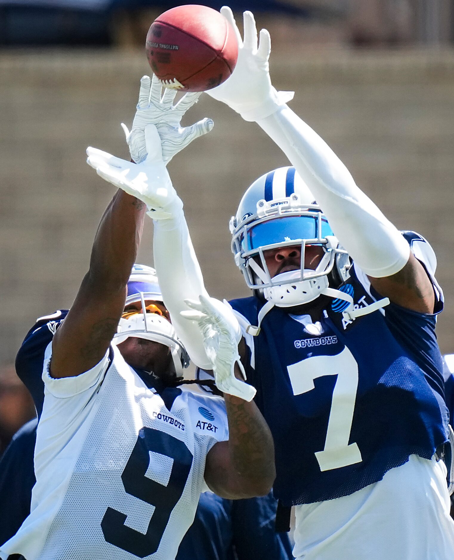 Dallas Cowboys cornerback Trevon Diggs (7) reaches for a ball against wide receiver KaVontae...