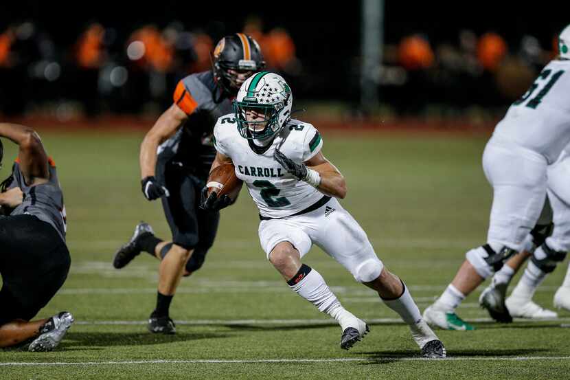 Southlake Carroll sophomore running back Owen Allen (2) carries the ball during the first...