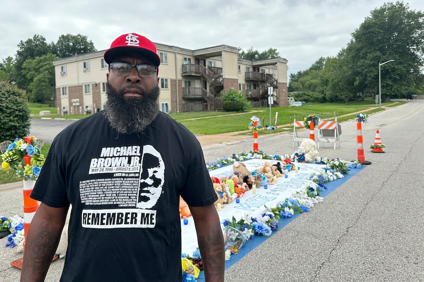 Michael Brown Sr. stands near the memorial to his son on Canfield Drive in Ferguson, Mo., on...