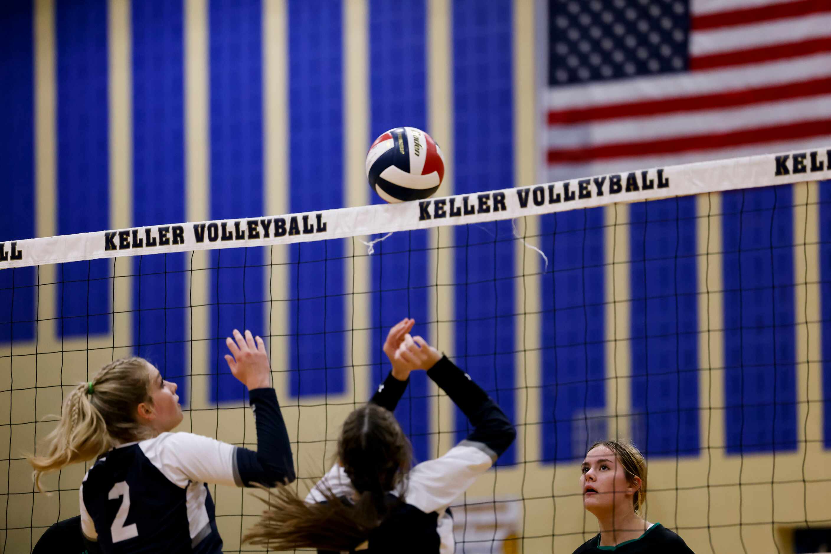 Southlake Carroll’s Brooklyn Harter (11) watches the ball sit on the net for a moment after...