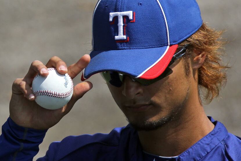 A close-up of Yu Darvish and his grip on the baseball before the Texas Rangers vs. the...