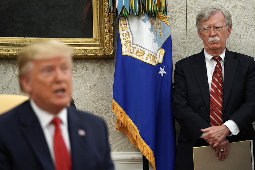 Then-national security adviser John Bolton listens as President Donald Trump speaks at the...