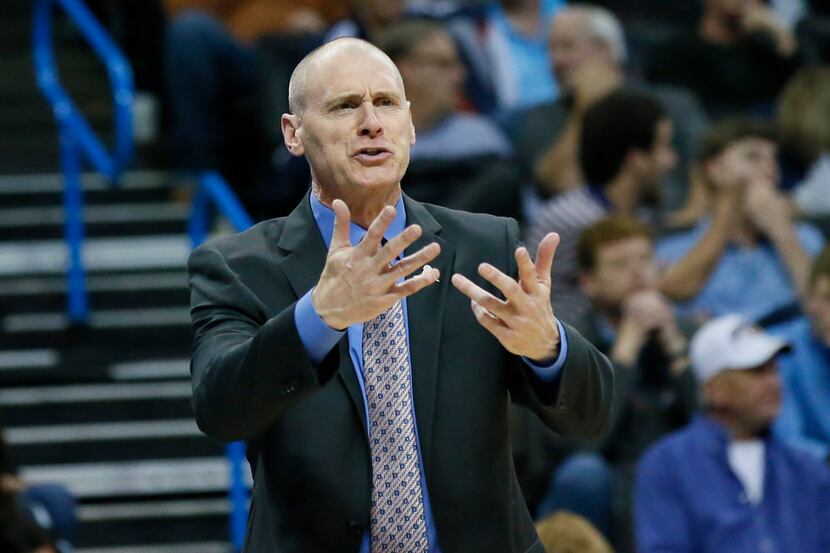 Dallas Mavericks head coach Rick Carlisle gestures in the third quarter of an NBA basketball...