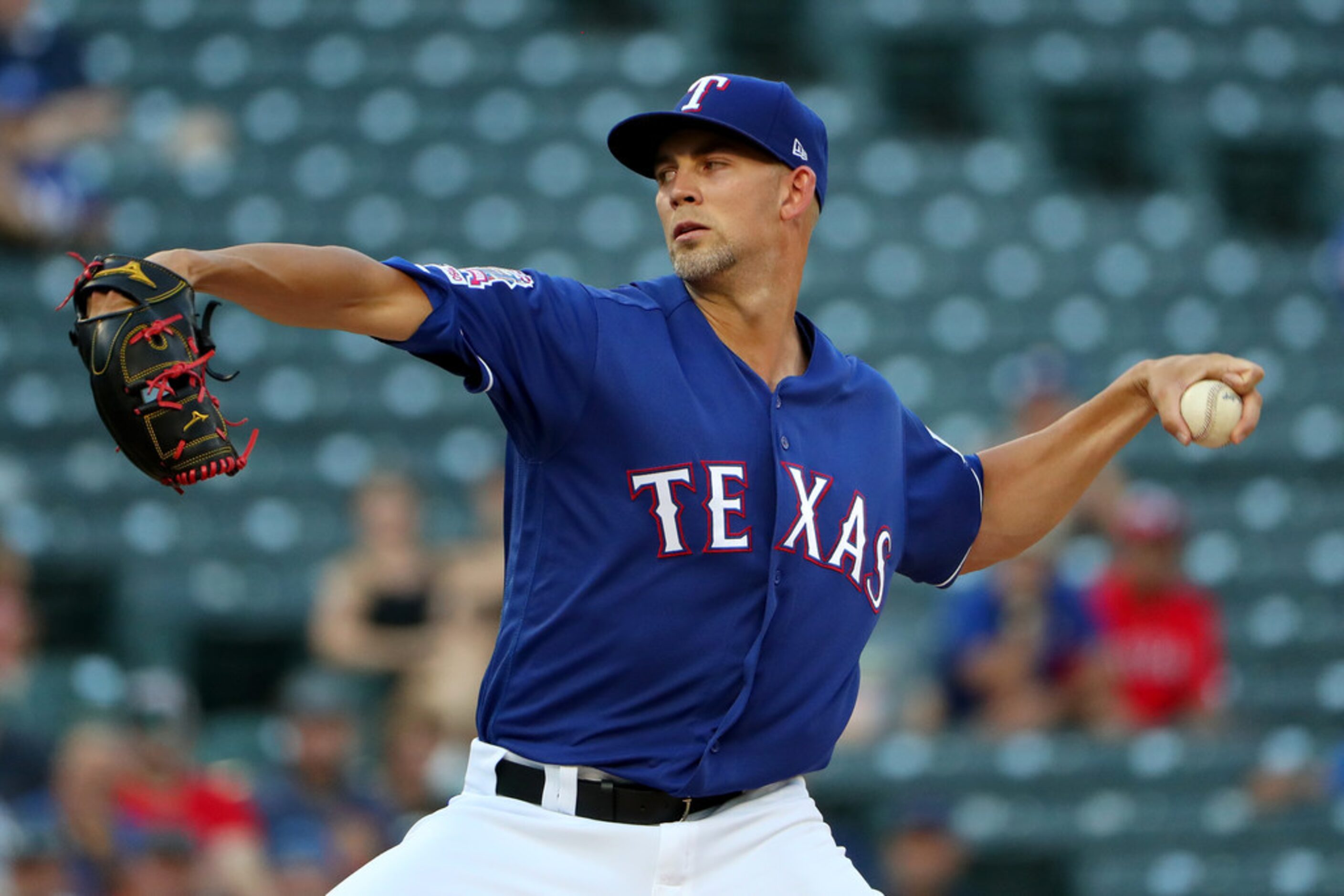 ARLINGTON, TEXAS - AUGUST 16: Mike Minor #23 of the Texas Rangers pitches against the...