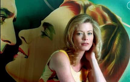 Actress Sheree J. Wilson with a film noir  poster in her North Dallas home. 