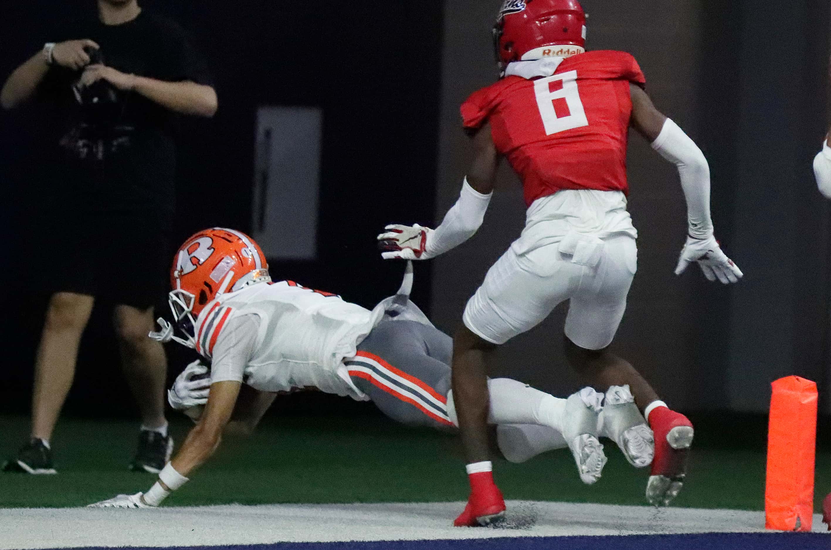Rockwall High School wide receiver Kai Helton (1) got his feet down in the end zone for a...
