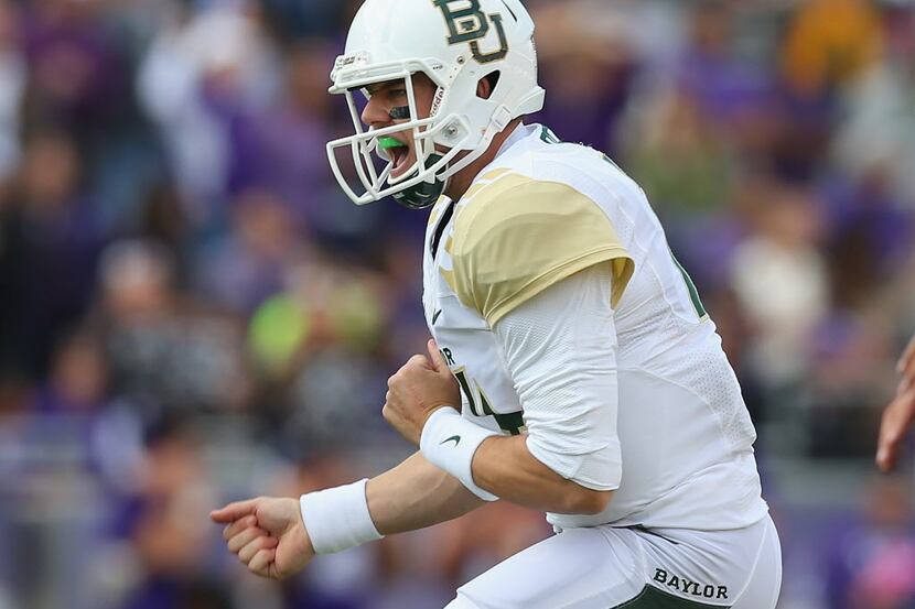 Bryce Petty of the Baylor Bears celebrates a touchdown against the TCU Horned Frogs at Amon...