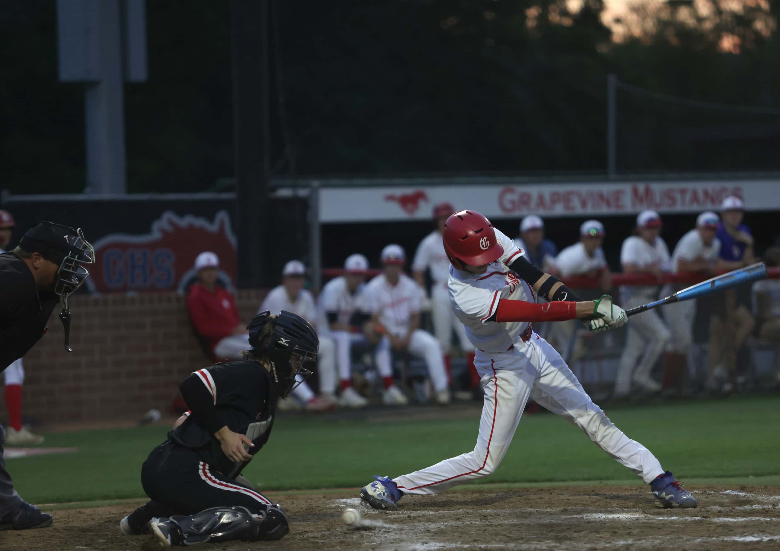 Grapevine High School player Gianni Corral tips the ball during a baseball game against...