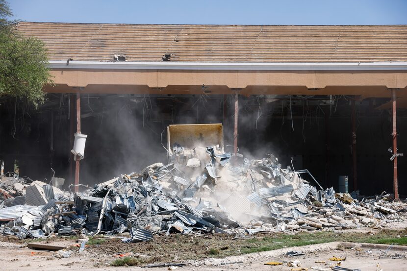 The eastern portion of the former Plaza National Bank shopping center is being demolished...