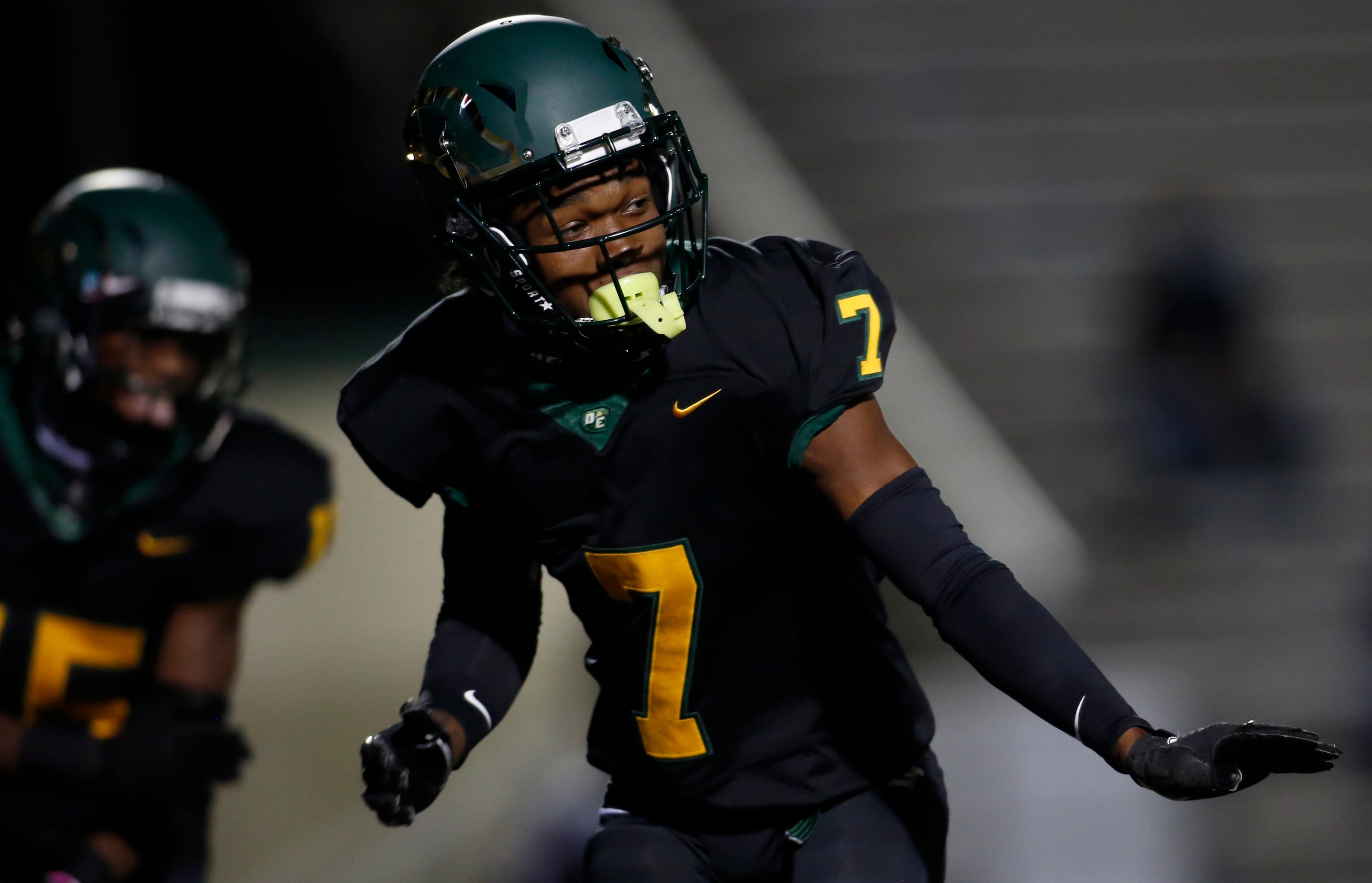 DeSoto defensive back Lathan Adams (7) sports a smile as he celebrates an interception that...