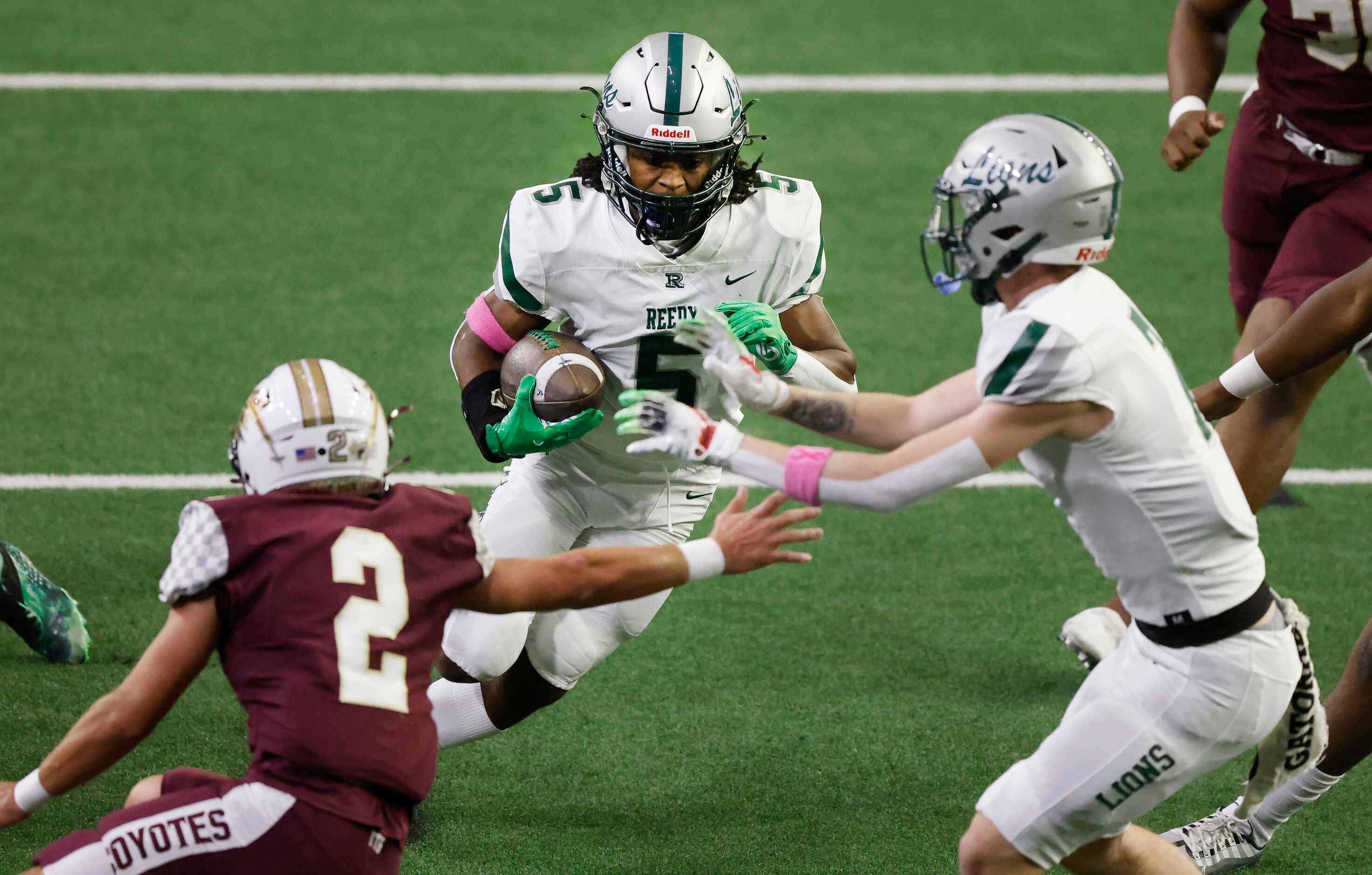 Frisco Reedy running back Devin Hardy (5) carries the ball against Frisco Heritage during...