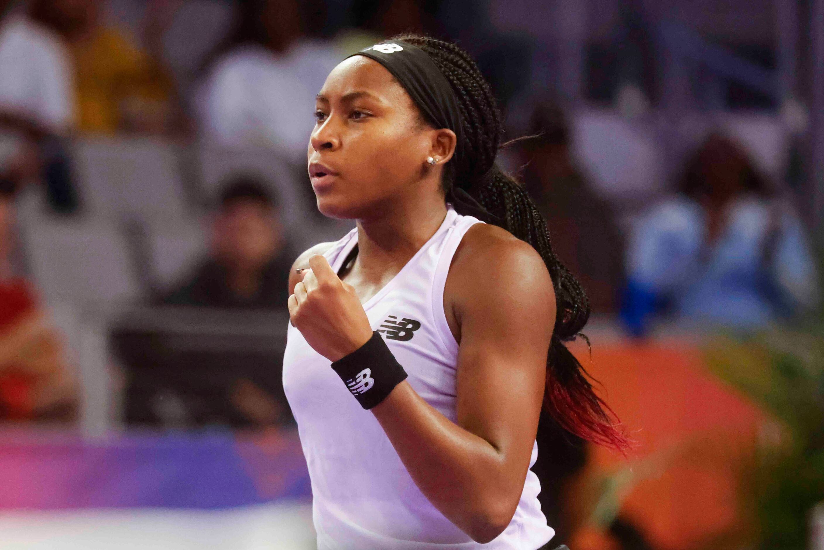 Coco Gauff of the USA reacts after scoring a point against Caroline Garcia of France on day...