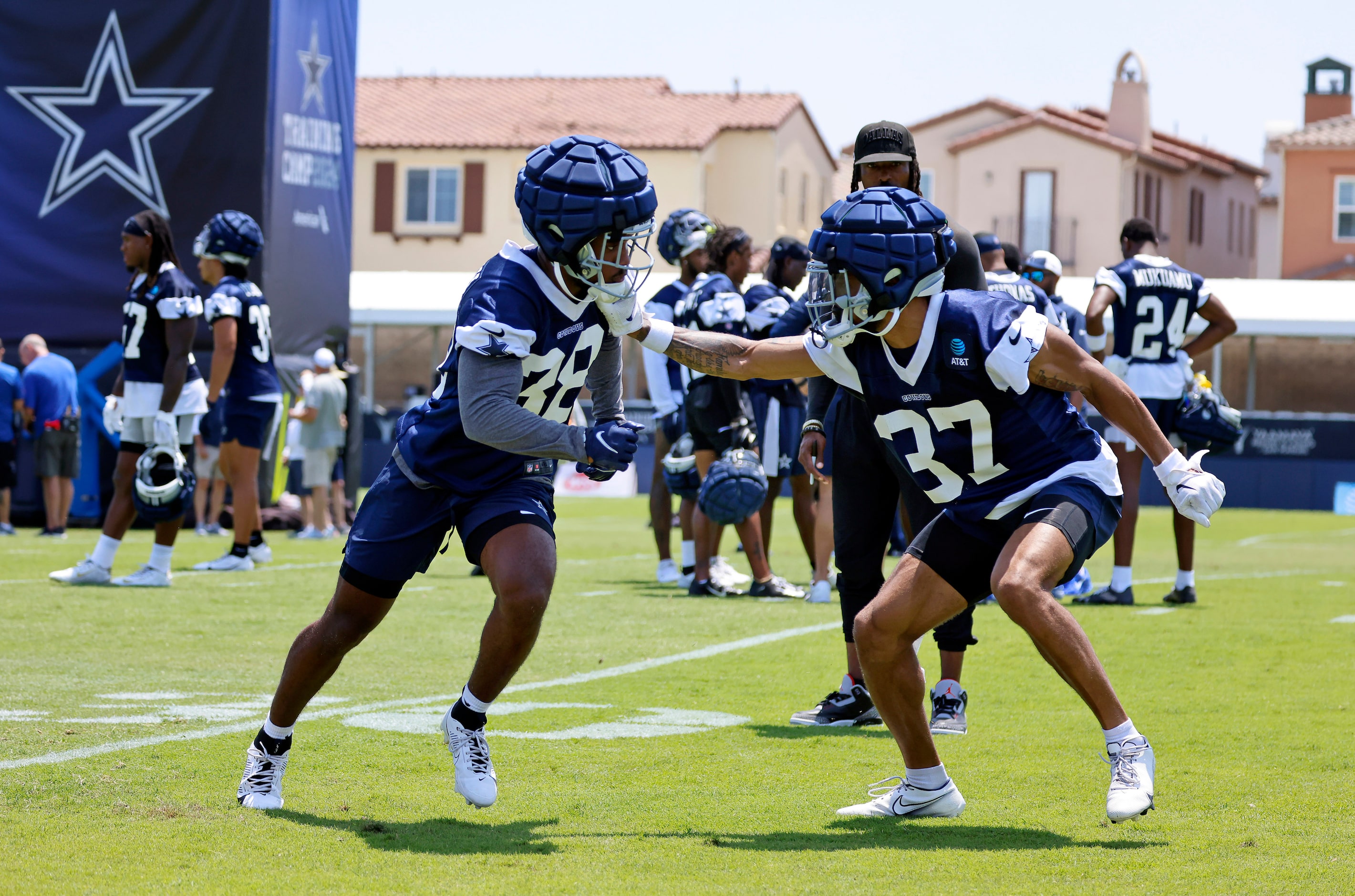 Dallas Cowboys cornerbacks Josh DeBerry (38) and Eric Scott (37) square off against lane...