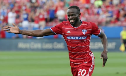 FC Dallas forward Roland Lamah celebrates scoring a goal during the first half of an MLS...