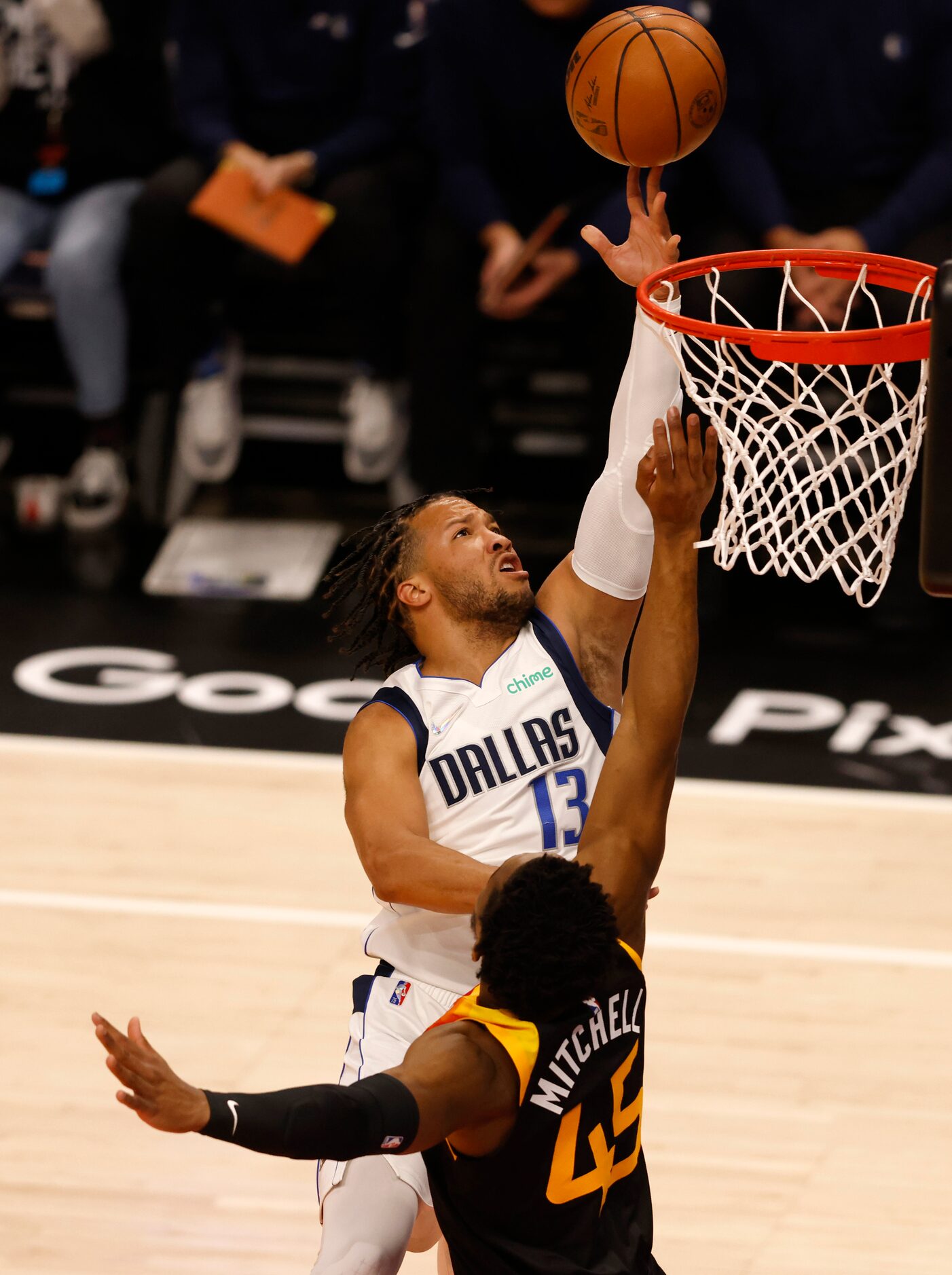 Dallas Mavericks guard Jalen Brunson (13) attempts a layup in front of Utah Jazz guard...