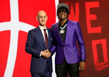 Ja'Kobe Walter, right, poses for a photo with NBA commissioner Adam Silver after being...