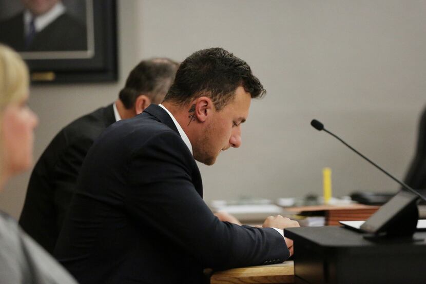 Former Texas A&M quarterback Johnny Manziel takes a seat before a hearing with judge Roberto...