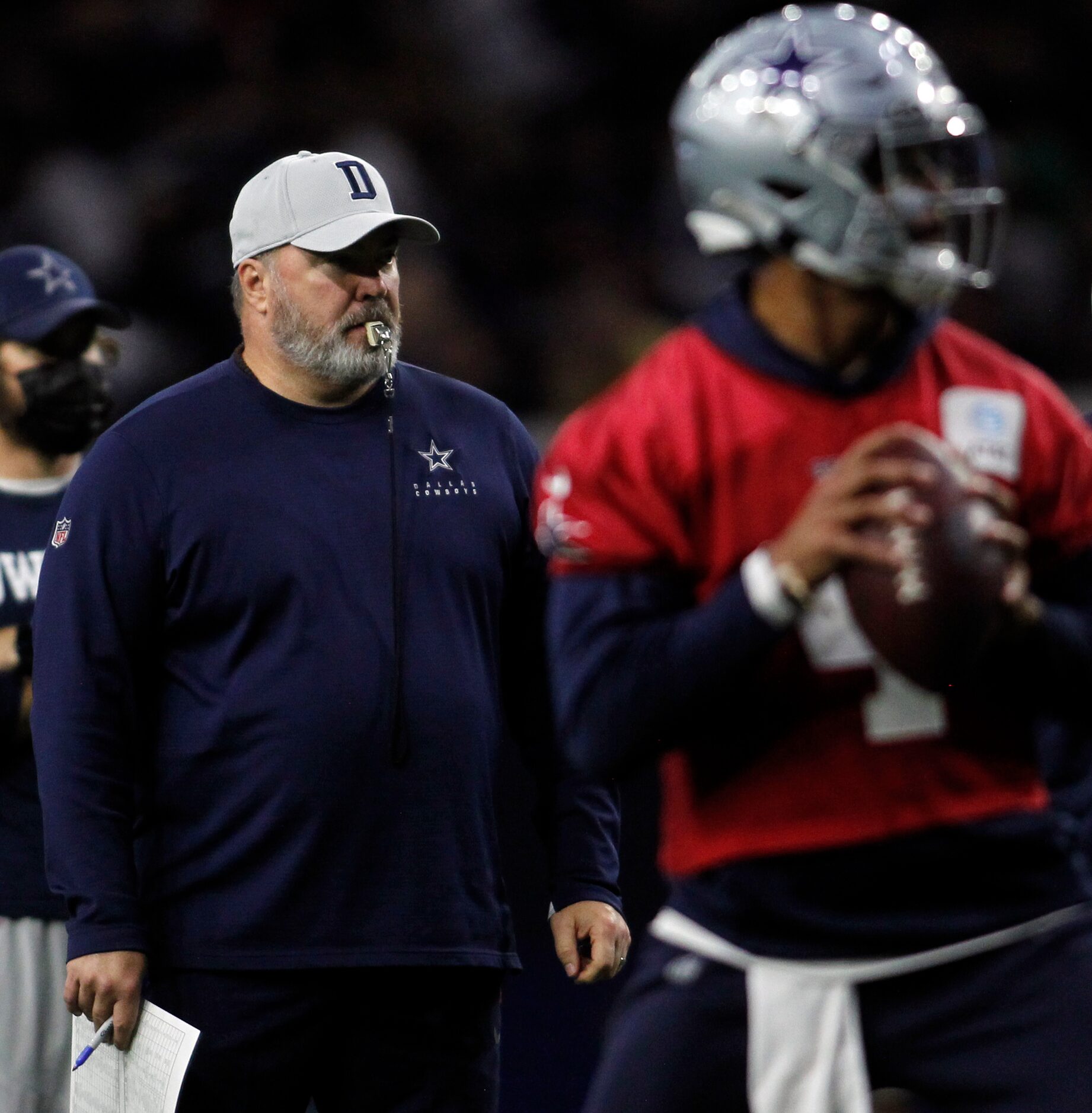 Dallas Cowboys head coach Mike McCarthy, left watches as quarterback Dak Prescott (4) looks...