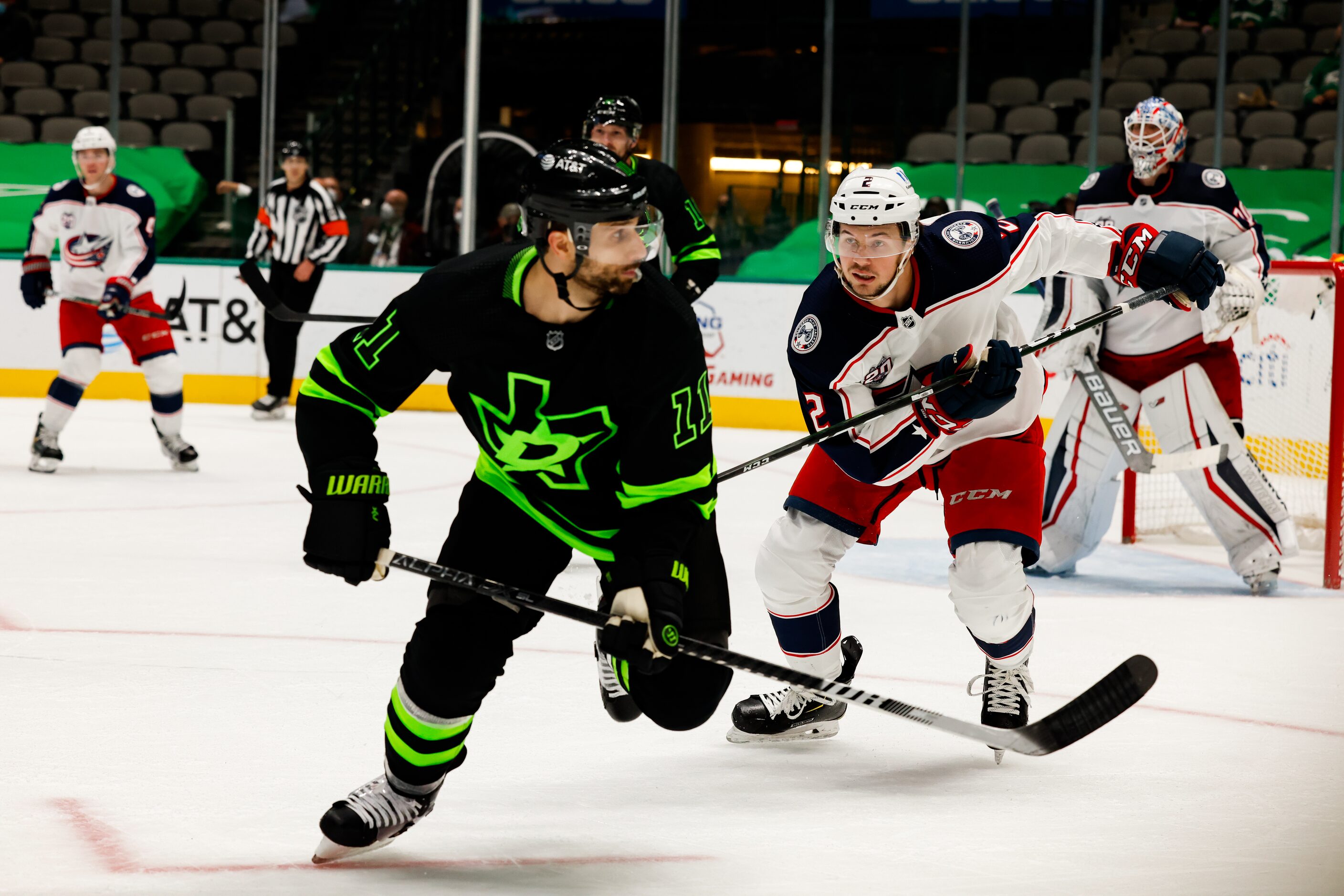 Columbus Blue Jackets defenseman Andrew Peeke (2) chases after Dallas Stars center Andrew...