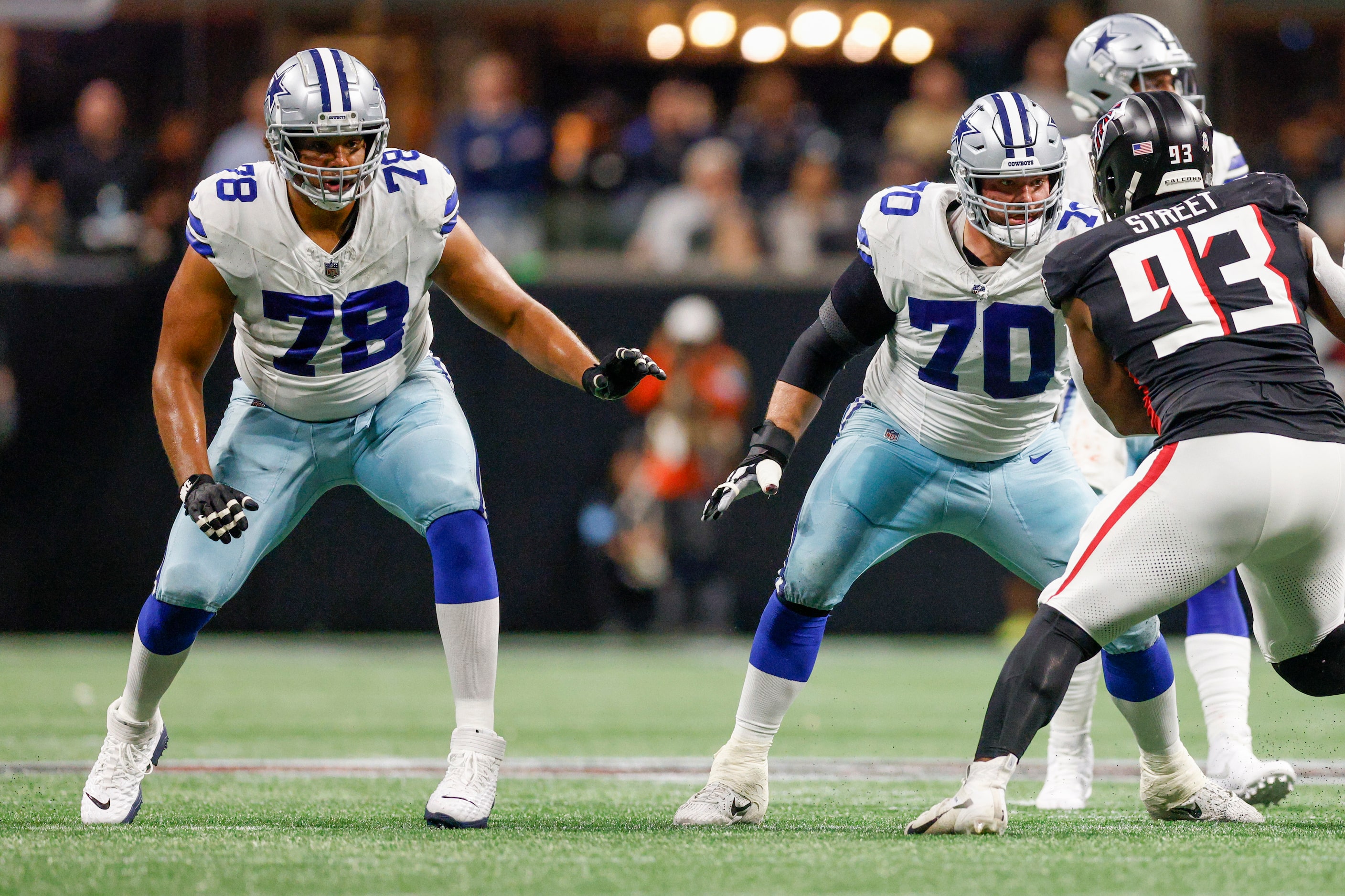 Dallas Cowboys offensive tackle Terence Steele (78) and guard Zack Martin (70) block Atlanta...