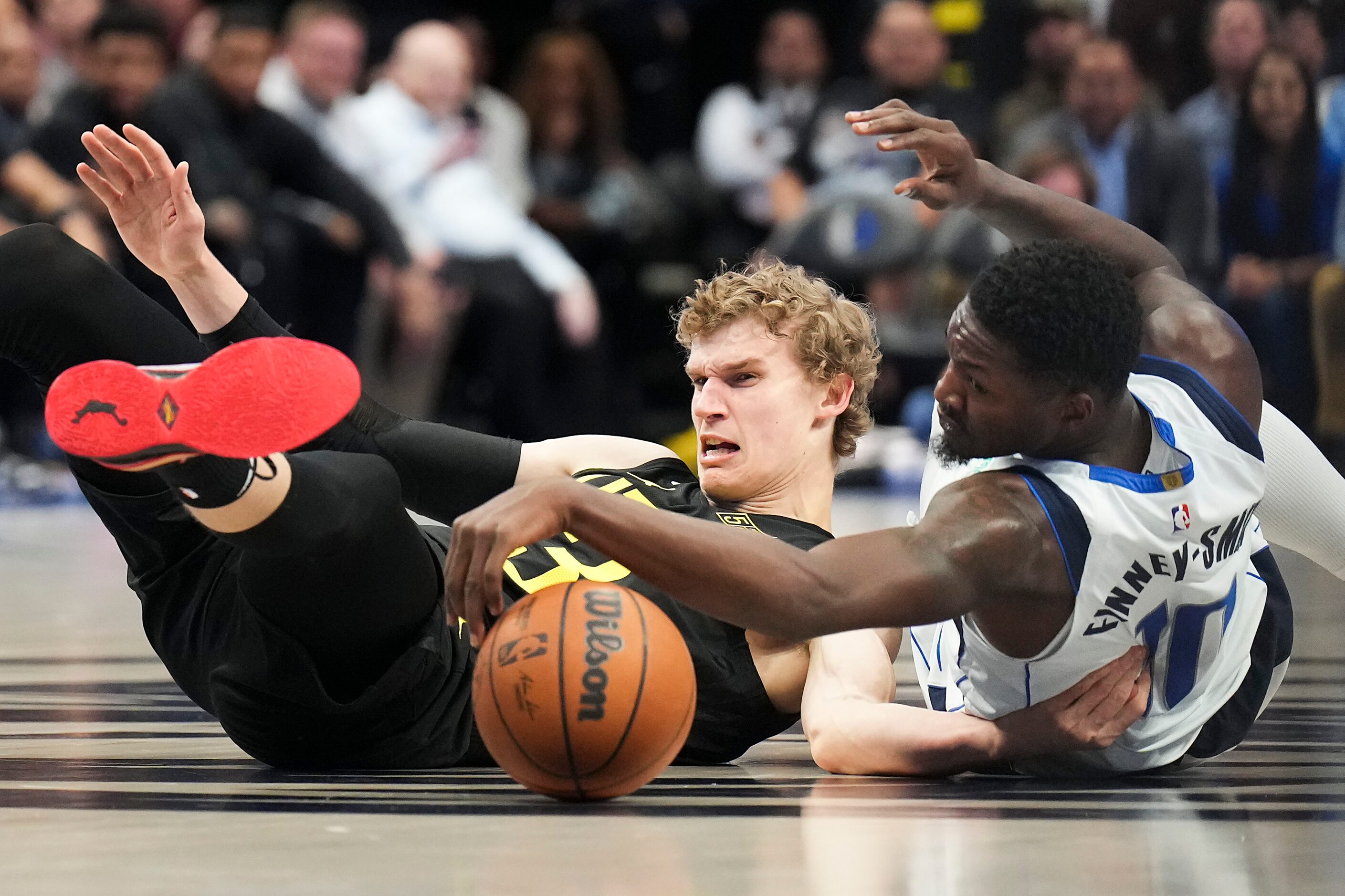 Dallas Mavericks forward Dorian Finney-Smith (10) fights for a loose ball against Utah Jazz...