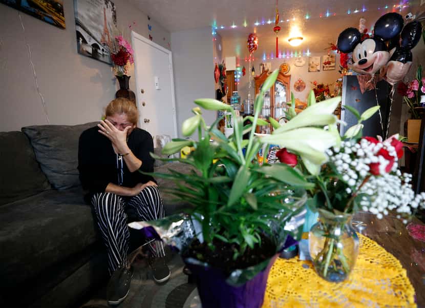 Lilian Navarrete wipes her tears as she talks to The Dallas Morning News about her son Jose...