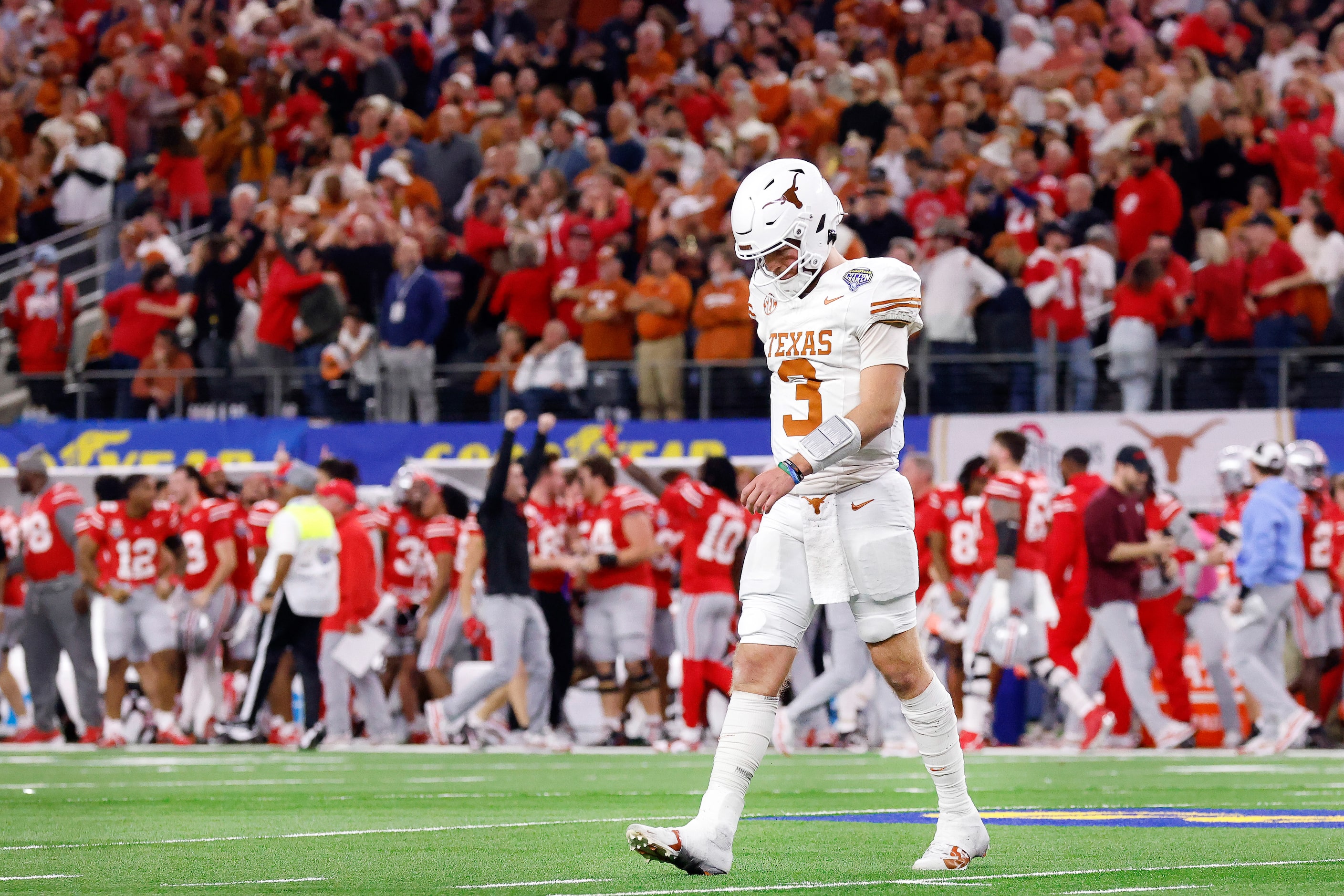 Texas Longhorns quarterback Quinn Ewers (3) walks to the bench after Ohio State Buckeyes...