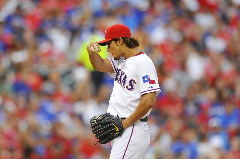 Texas Rangers starting pitcher Yu Darvish pitches in the sixth inning against the Oakland...