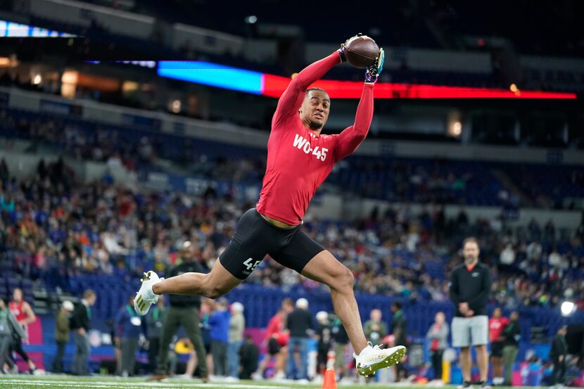 Ohio State wide receiver Jaxon Smith-Njigba runs a drill at the NFL football scouting...