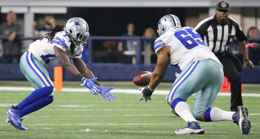 Dallas Cowboys wide receiver Lucky Whitehead (13) and Dallas Cowboys guard Ronald Leary (65)...